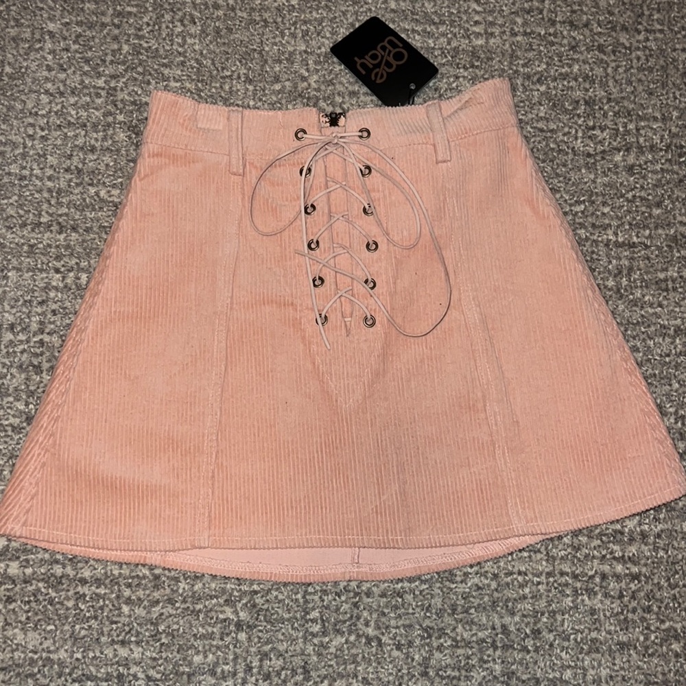 LF store One Way corduroy skit with lace up front zipper back.